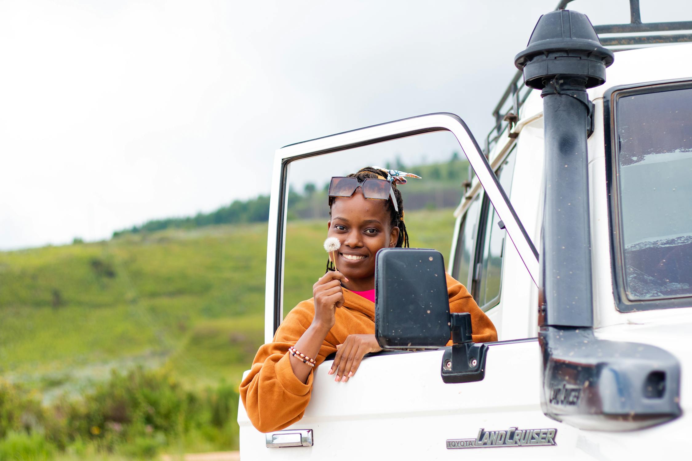 free photo of woman standing in open doors of truck